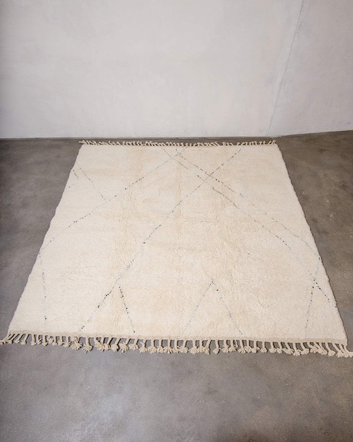 Modern, designer, handcrafted Berber rug from Morocco. Beniourain carpet with minimalist design, natural wool pile and a fluffy texture.